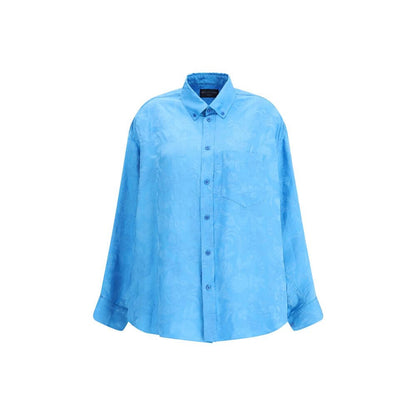 Balenciaga Blue Viscose Pattern Shirt with cocoon silhouette and elegant floral design, showcasing a rounded hem and button-down collar.