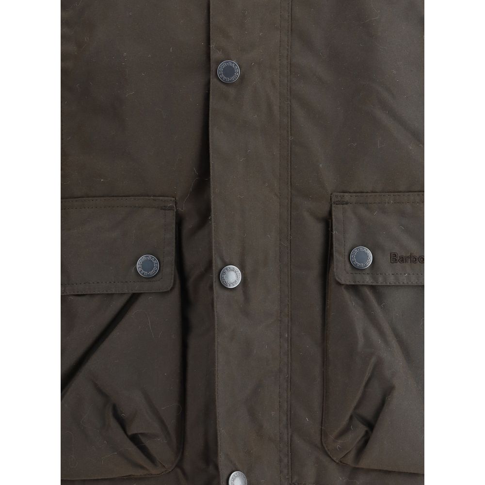 Close-up view of Barbour Brown Cotton Rain Coat with buttoned flap patch pockets and snap closures.