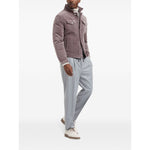Brunello Cucinelli Drawstring trousers in beluga grey virgin wool with a tapered leg and elasticated waistband. Styled with a buttoned jacket.