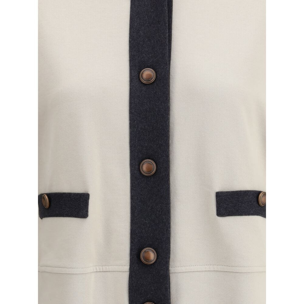 Close-up of Brunello Cucinelli Gray Cotton Cardigan with button closure and welt pockets.