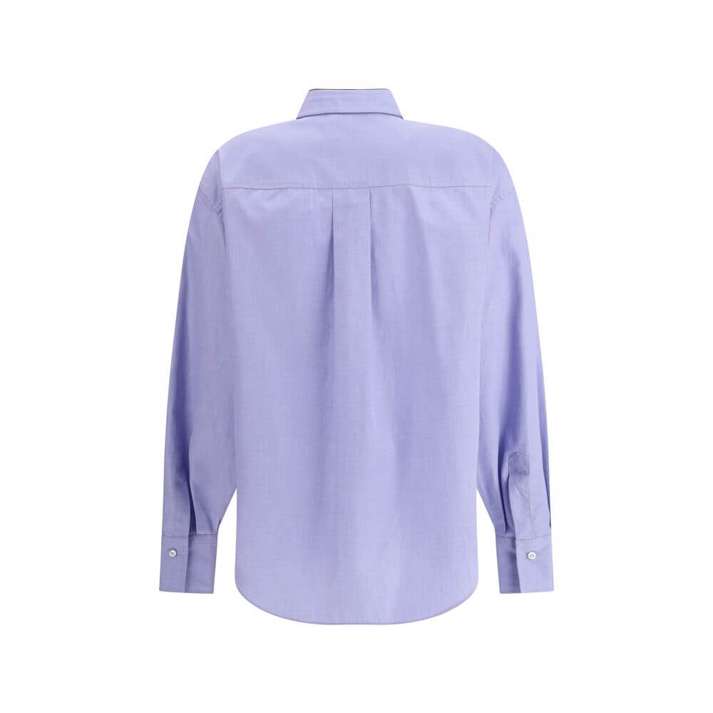 Back view of Brunello Cucinelli Light Blue Cotton Dress Shirt, featuring classic design and asymmetrical hemline for contemporary style.