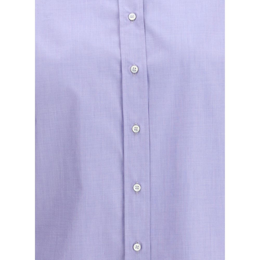 Close-up of Brunello Cucinelli Light Blue Cotton Dress Shirt with buttons and shiny jewels on collar, showcasing elegance and modernity.