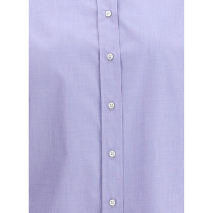 Close-up of Brunello Cucinelli Light Blue Cotton Dress Shirt with buttons and shiny jewels on collar, showcasing elegance and modernity.