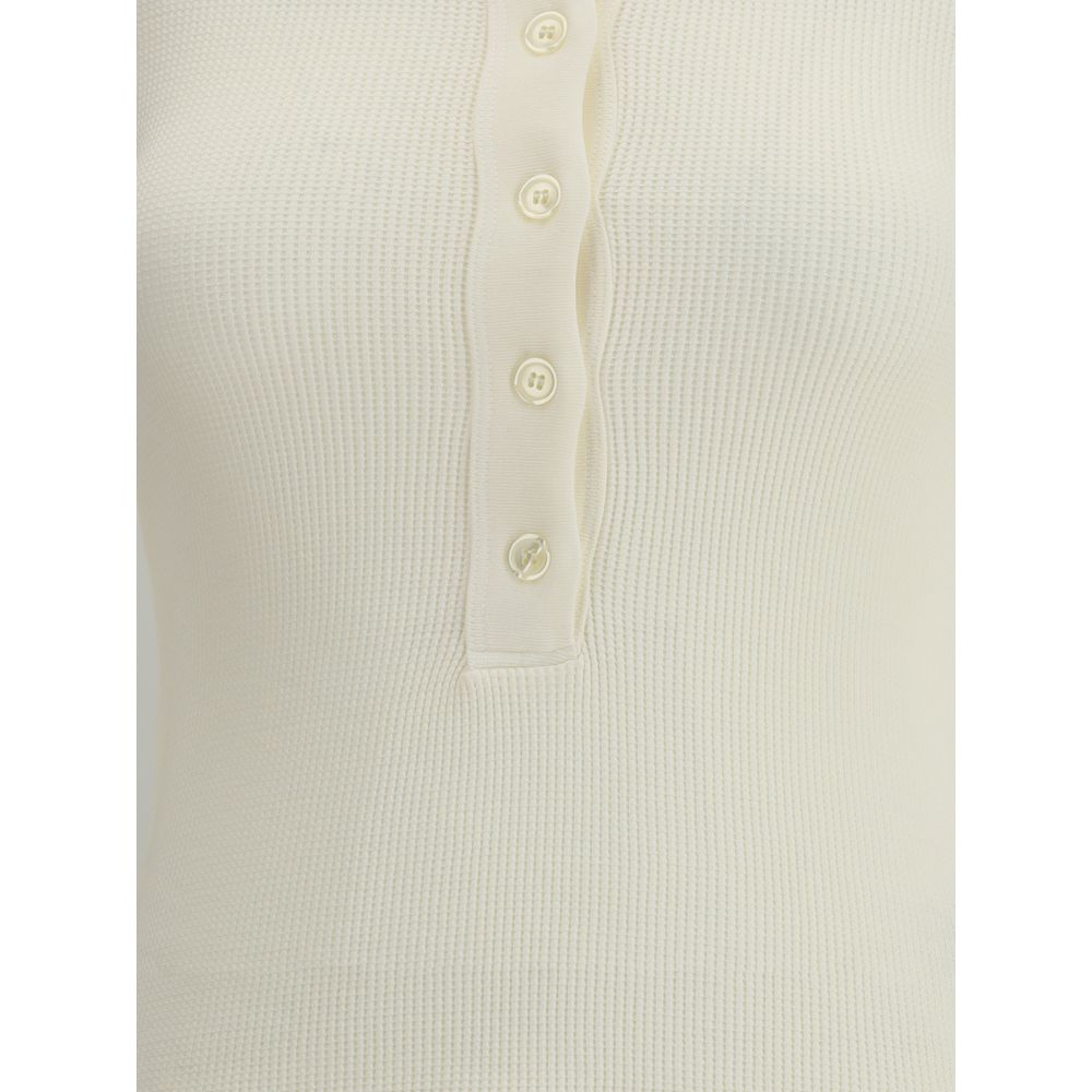 Close-up of Citizens of Humanity White Cotton Top with ribbed texture and button closure.