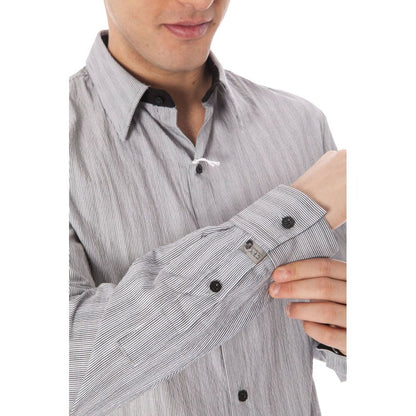 Model wearing Costume National White Cotton Men Shirt with Italian collar and buttoned cuffs.