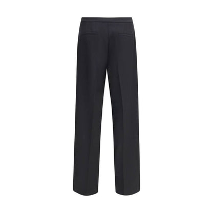 Back view of Cruna Black Polyester Casual Pants with wide leg design, zip and button fastening, featuring side and welt pockets.