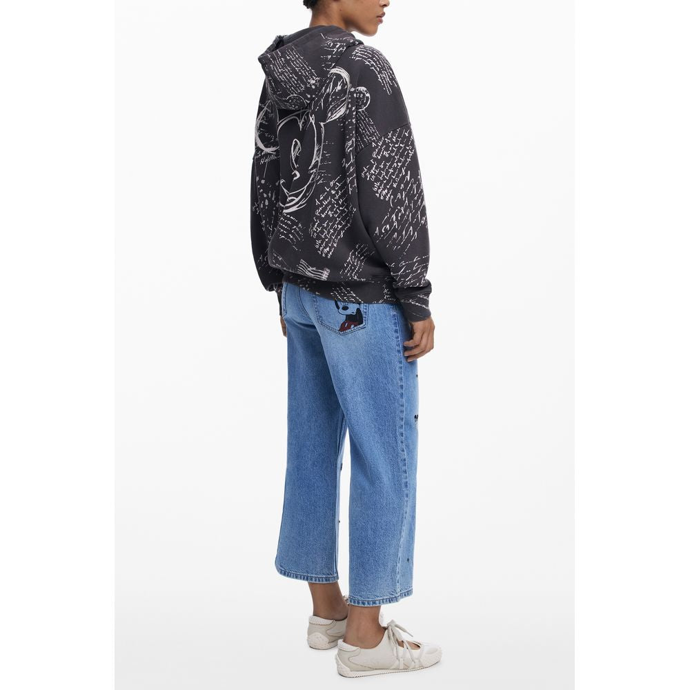 Desigual Black Cotton Women Hoodie with Mickey print, showcasing street style fashion, side view, paired with blue jeans and white sneakers