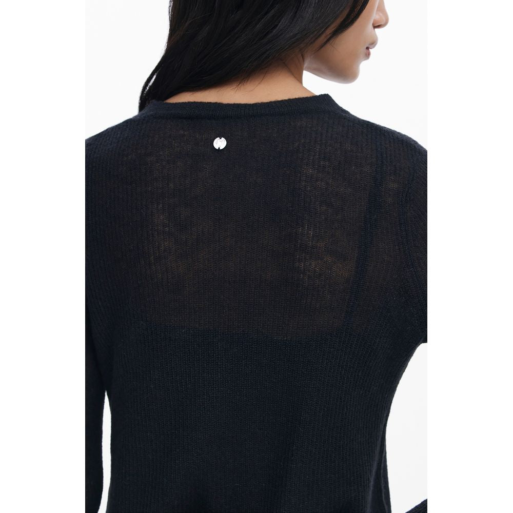 Back view of Desigual Black Polyester Women Dress showcasing brand emblem and knit texture.