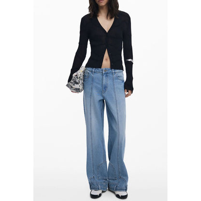 Model wearing Desigual Black Viscose Women Cardigan, featuring chic buttons and trendy style, paired with casual jeans for a stylish look.