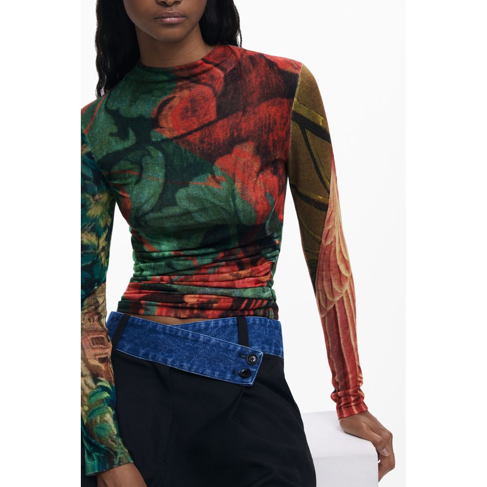 Model wearing Desigual Green Viscose Women Sweater with vibrant pattern and iconic logo.