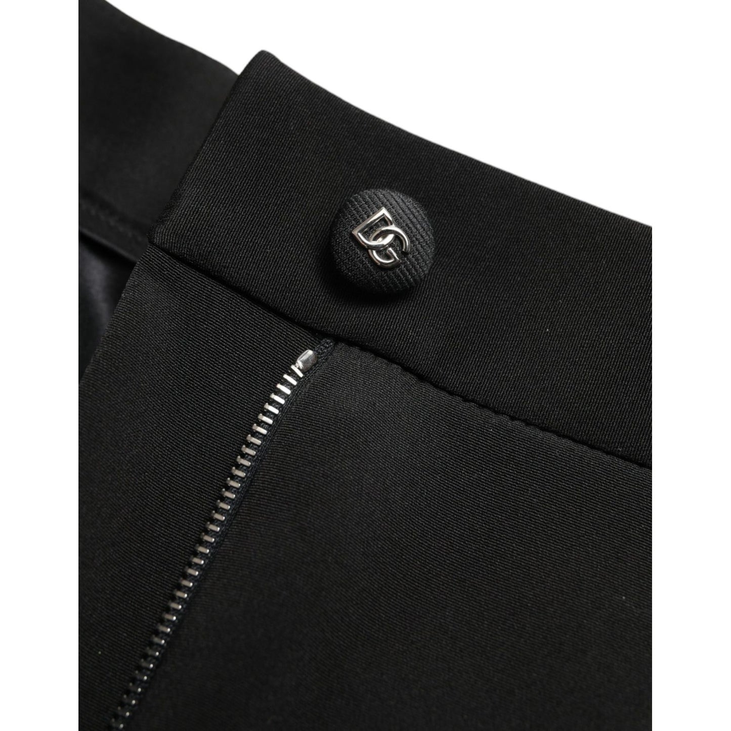Close-up of Dolce & Gabbana Black Wool Stretch High Waist Skinny Pants with zipper and logo detail.