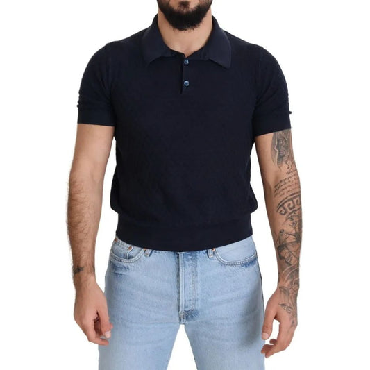 Man wearing Dolce & Gabbana Dark Blue Collared Polo Casual Silk T-shirt paired with jeans, showcasing short sleeves and regular fit.
