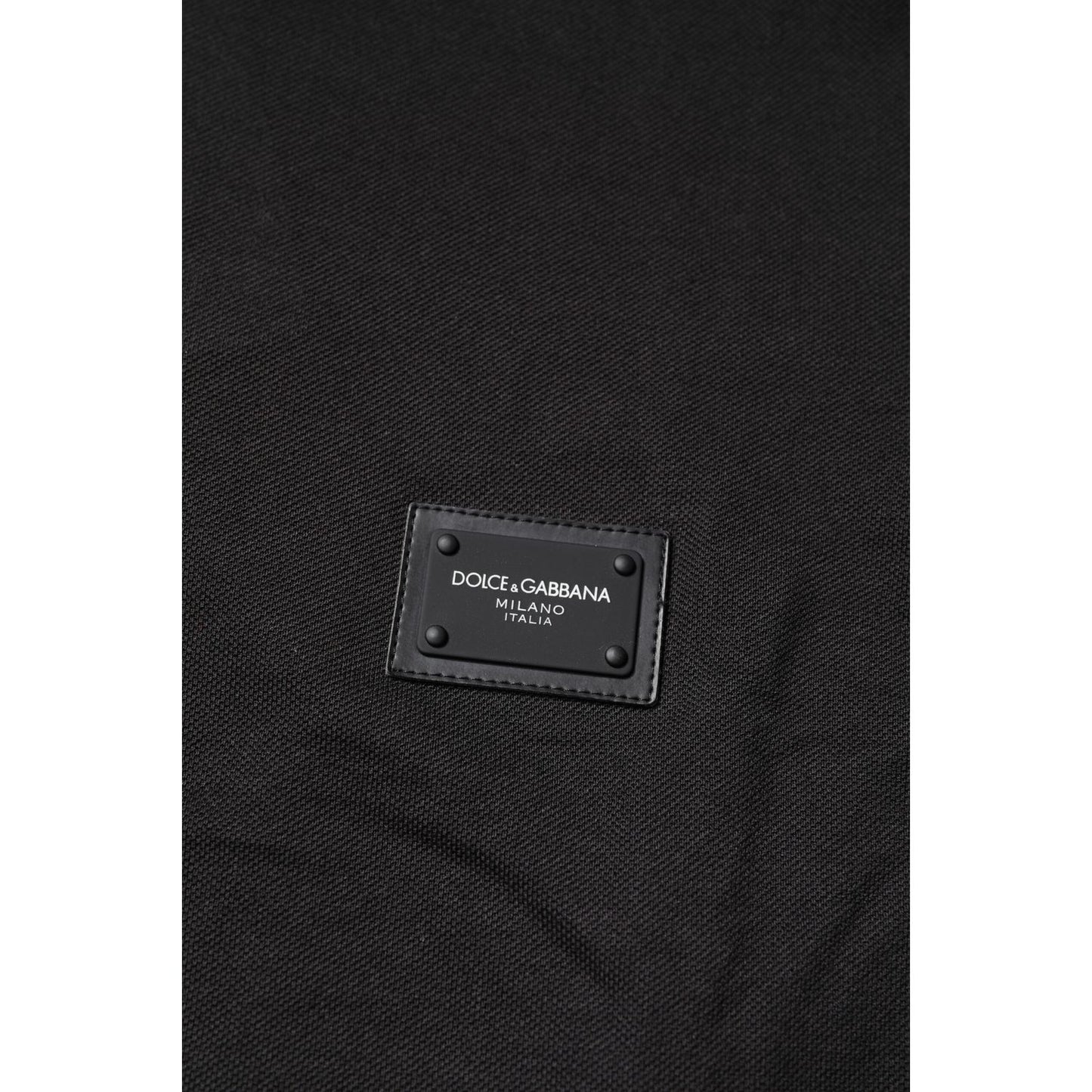 Close-up of Dolce & Gabbana Dark Gray Logo Plaque Cotton Men Polo Shirt T-shirt showing logo plaque detail.