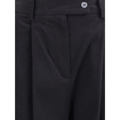 Close-up of Ella Black Cotton Casual Pants with front pleats, button closure, and wide leg design.