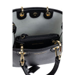 Interior view of Emporio Armani MyEA shopping bag with black logo print, showing compartment, gold accents, and removable pouch.