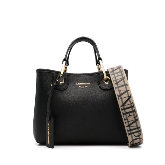 Emporio Armani MyEA small shopping bag in black faux leather with gold-tone hardware, adjustable shoulder strap, and debossed logo.