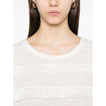Model wearing Emporio Armani T-shirt with fringes, cotton crew neck, short sleeves, embroidered logo, true to size fit.