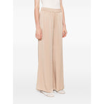 Fabiana Filippi Trousers Powder - beige wide-leg trousers with elasticated waist and side pockets, perfect fit, showcased by model.