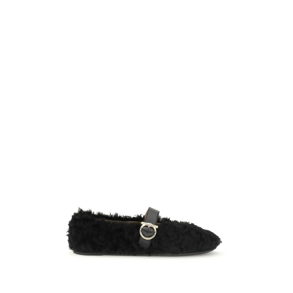 Ferragamo Black Fur Ballet Flats with Gancini buckle and shearling lining, perfect for AW25. Features a flexible rubber sole and contoured neckline.