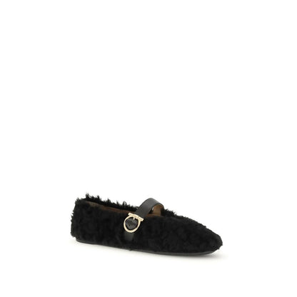 Ferragamo Black Fur Ballet Flats with Gancini buckle and shearling lining, perfect for the cold season, featuring a flexible rubber sole.