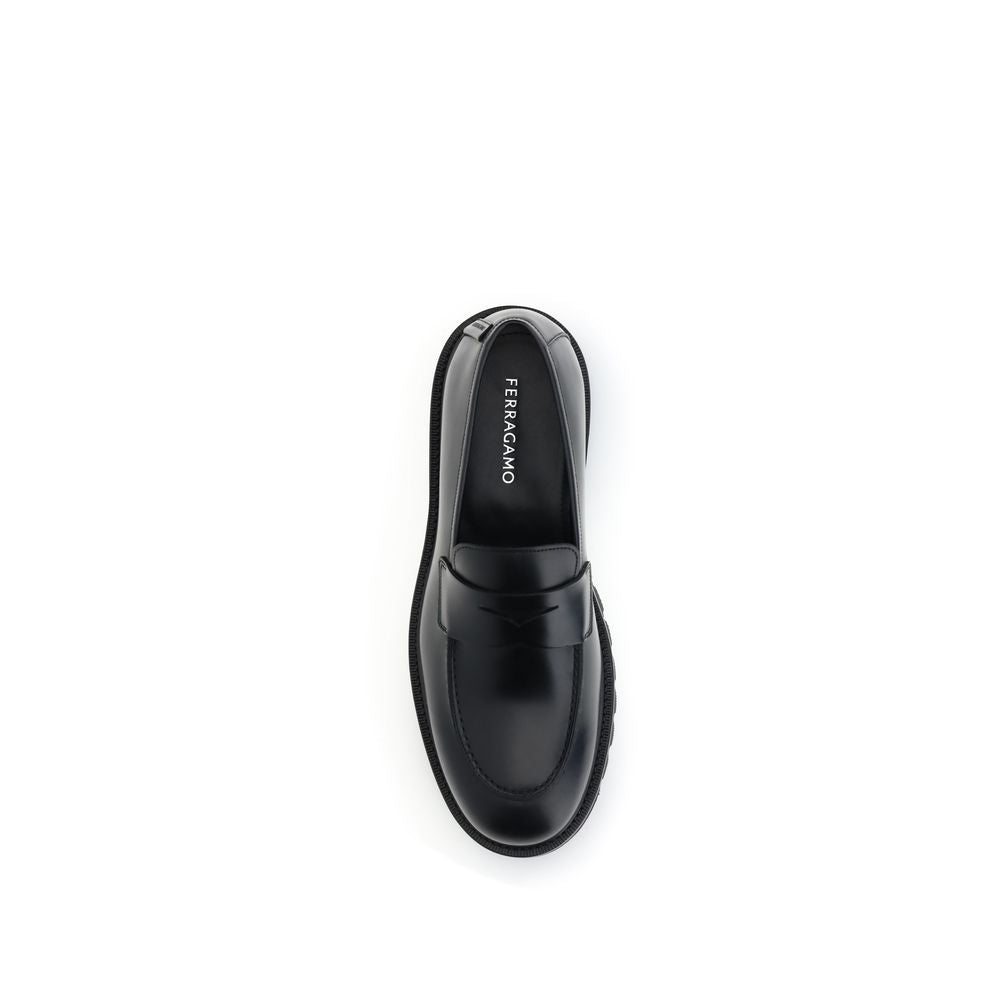 Ferragamo Black Rubber Slip-On Loafers with calfskin upper and rugged tread.