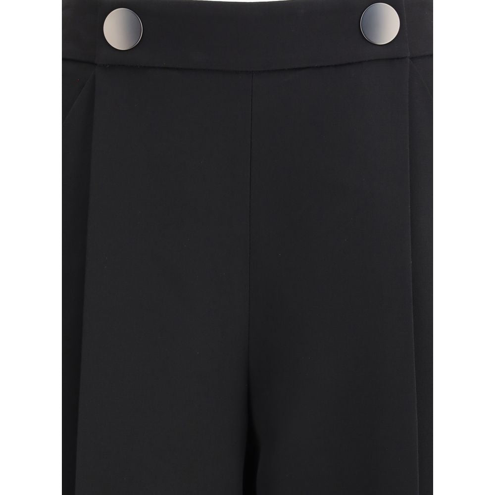 Giorgio Armani Black Silk Casual Pants with distinctive button detail, showcasing elegant design and craftsmanship in crepe cady fabric.