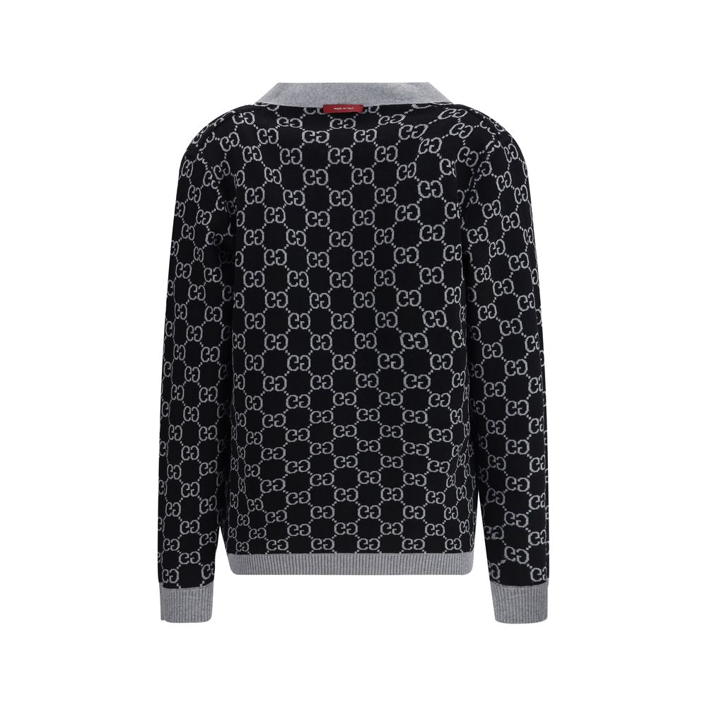 Rear view of Gucci Black Wool Cardigan with GG Supreme pattern, reversible design in black and white wool, featuring ribbed trim.