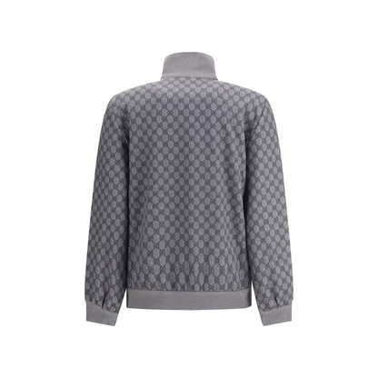 Back view of Gucci Gray Polyester Sweatshirt featuring GG motif and ribbed cuffs, showcasing a blend of sporty style and sophistication.