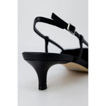Side view of Guess Black Polyester High Heel with slingback design and adjustable strap.