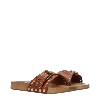 Isabel Marant Brown Leather Slippers with open toe and buckle closure, featuring cognac color accents and rubber sole.