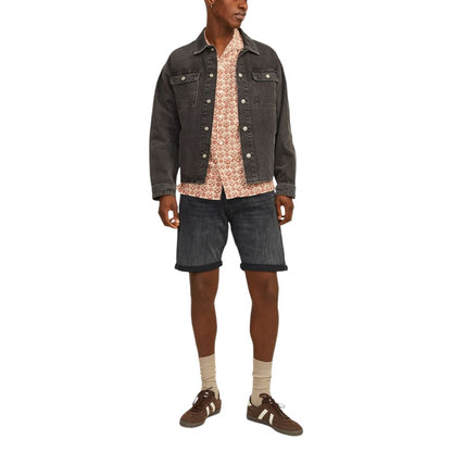 Man wearing Jack Jones Black Cotton Bermuda Shorts with a casual jacket and shirt, showcasing a stylish and comfortable summer outfit.