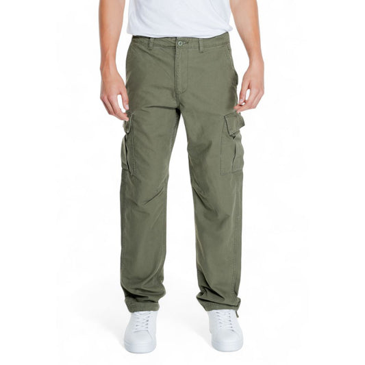 Man wearing Jack Jones Green Cotton Cargo Pants with side pockets and tapered fit for comfort and style, showcasing modern design.