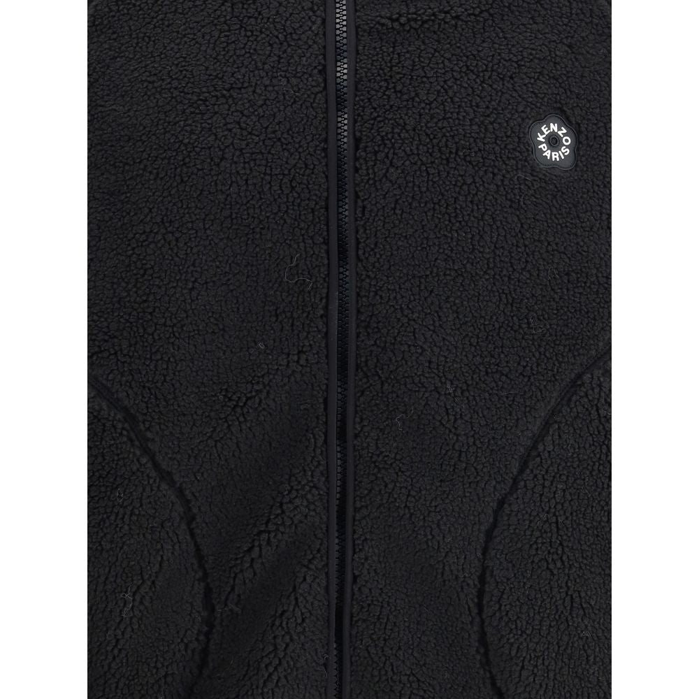 Close-up of Kenzo Black Polyester Full-Length Jacket with logo and soft fleece texture, featuring a practical front zipper.