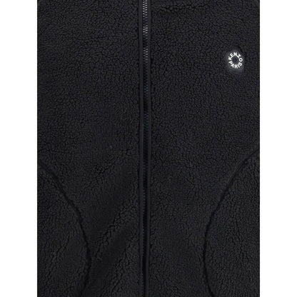 Close-up of Kenzo Black Polyester Full-Length Jacket with logo and soft fleece texture, featuring a practical front zipper.