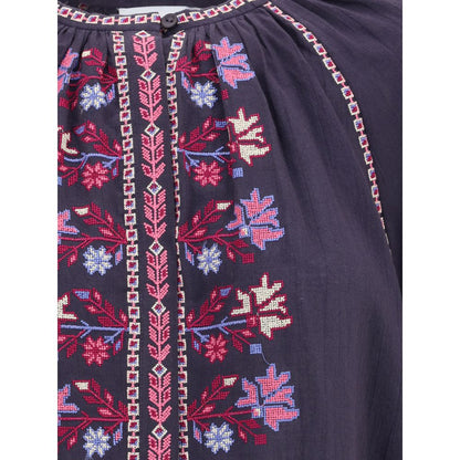 Detailed embroidery on Marant Etoile Blue Cotton Blouse showcasing intricate cross-stitch patterns and buttons.