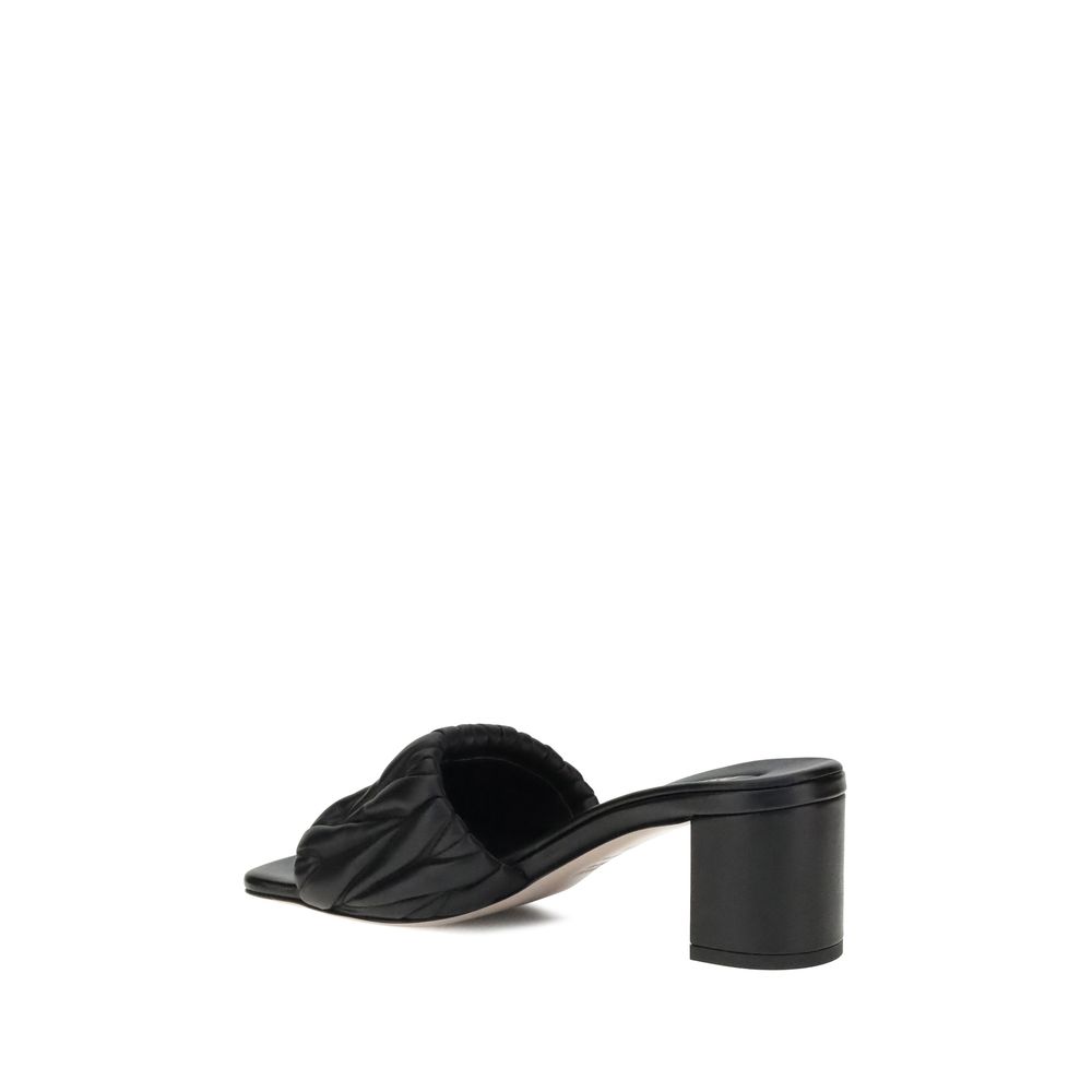 Side view of Miu Miu Black Lamb Ovis Aries Aries Stiletto Heel Sandals with padded straps and squared toe.