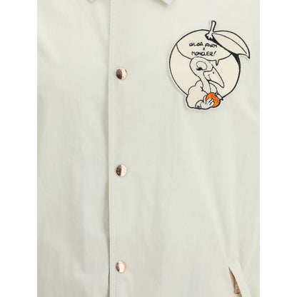 Moncler x Donald Glover White Cotton Coat featuring Gilga Farm comic-style patch and Moncler mascot embroidery.