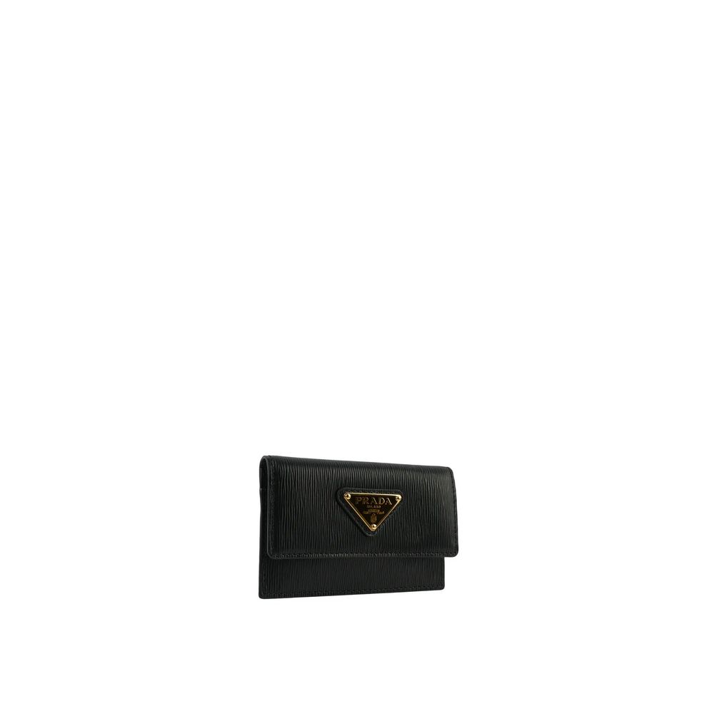 Prada Black Calfskin Cardholder with front logo plaque, two card slots, and flap top button closure, made of 100% calf leather.