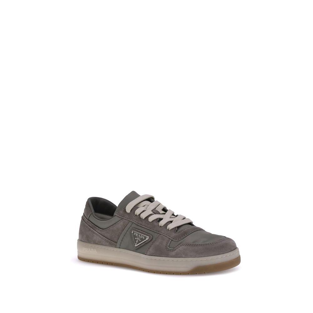 Prada Gray Calf Leather Bos Taurus Low Top Sneakers in suede leather with lace-up closure, featuring a flat sole and rounded toe design.