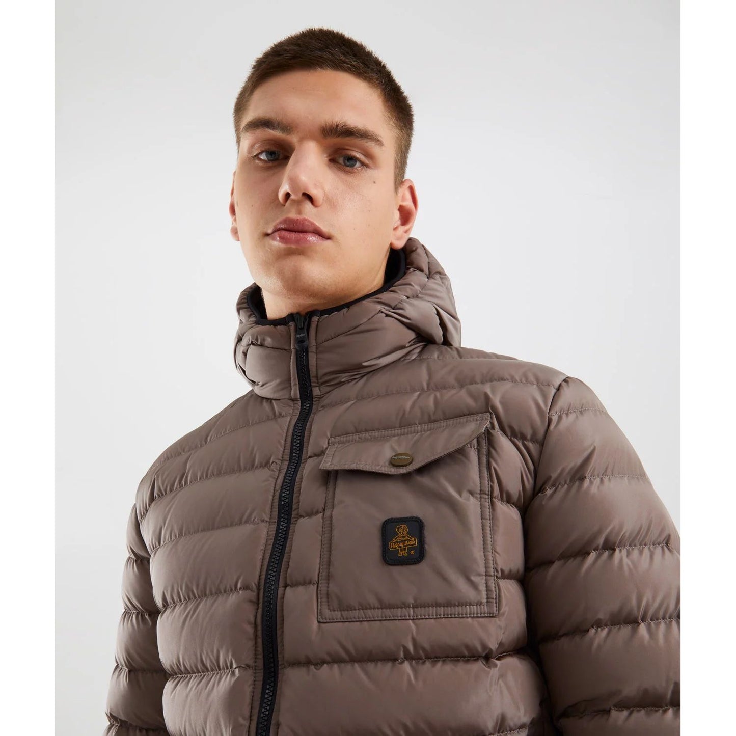 Refrigiwear Beige Nylon Men Jacket with hood and zip closure, featuring chest button pocket. Ideal for urban style and warmth.