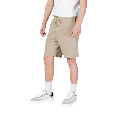 Model wearing Replay Beige Cotton Bermuda Shorts with elastic waistband and drawstring, showcasing casual summer style.