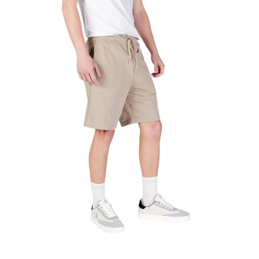 Replay Beige Cotton Bermuda Shorts with elastic waistband worn by male model