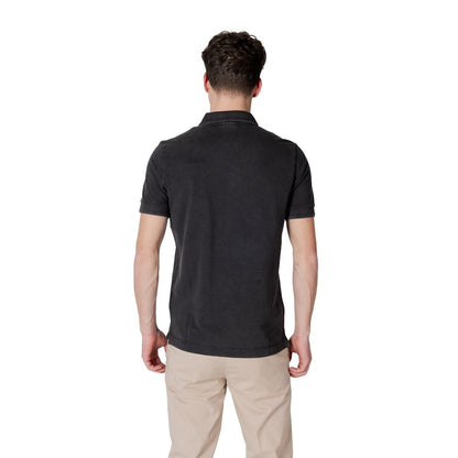 Back view of model wearing Replay Black Cotton Polo Shirt with ribbed collar and short sleeves.