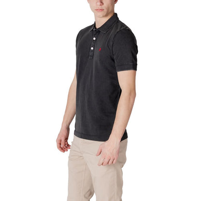 Man wearing Replay Black Cotton Polo Shirt with ribbed collar and embroidered logo, showcasing its casual and versatile design.