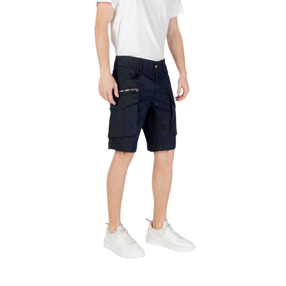 Man wearing Replay Blue Cotton Bermuda Shorts with side pockets, crafted from a cotton and elastane blend for comfort and mobility