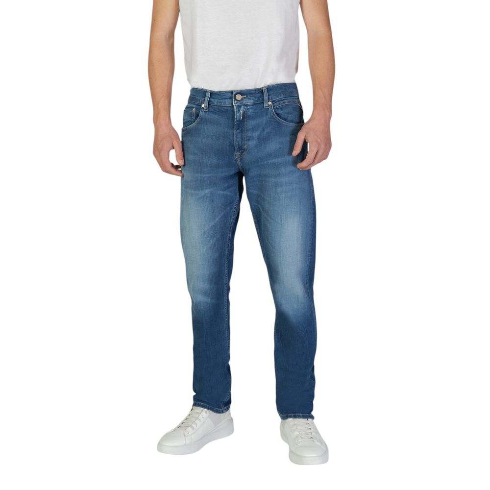 Model wearing Replay Blue Cotton Slim Fit Jeans with classic five-pocket design and tapered fit for comfort and style.