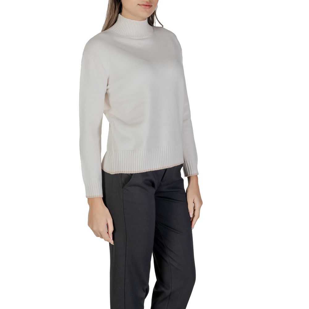 Woman wearing Street One Cream Polyester Sweatshirt with high neckline, black pants, showcasing comfort and style.