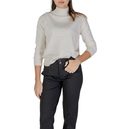 Woman wearing Street One Cream Polyester Sweatshirt with high neckline and ribbed hem, styled with contrasting trim for cozy comfort.