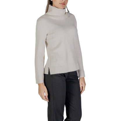 Street One Cream Viscose Turtleneck sweater with button details on high neck, shown on model. Cozy and stylish women's knit top for cooler days.