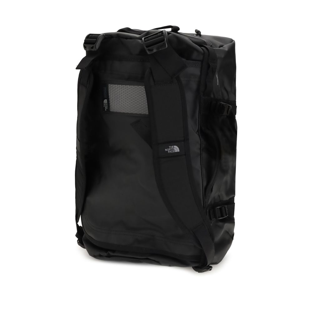 The North Face Black Nylon Luggage And Travel duffel bag, durable waterproof design, versatile with padded handles for easy carrying.